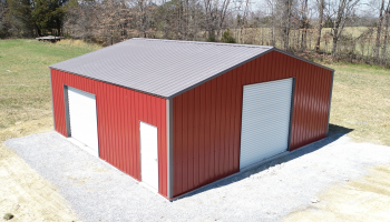 A JD Metals FastFrame Premium Steel Frame barn in Brick Red and Charcoal.